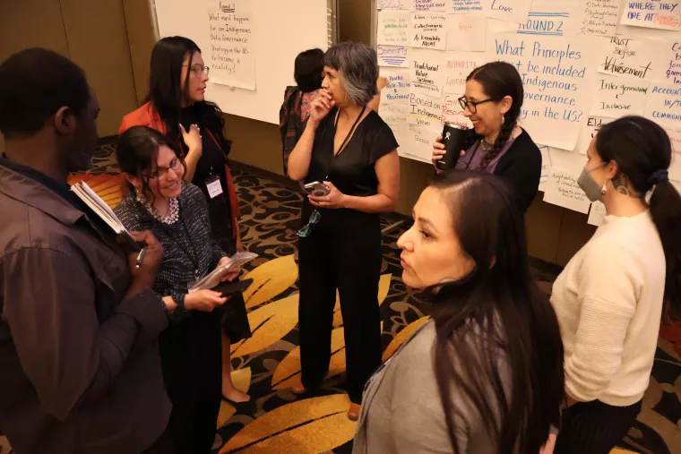 Summit organizers gather for a discussion during the pre-conference Tribal Leaders and Scholars Workshop.